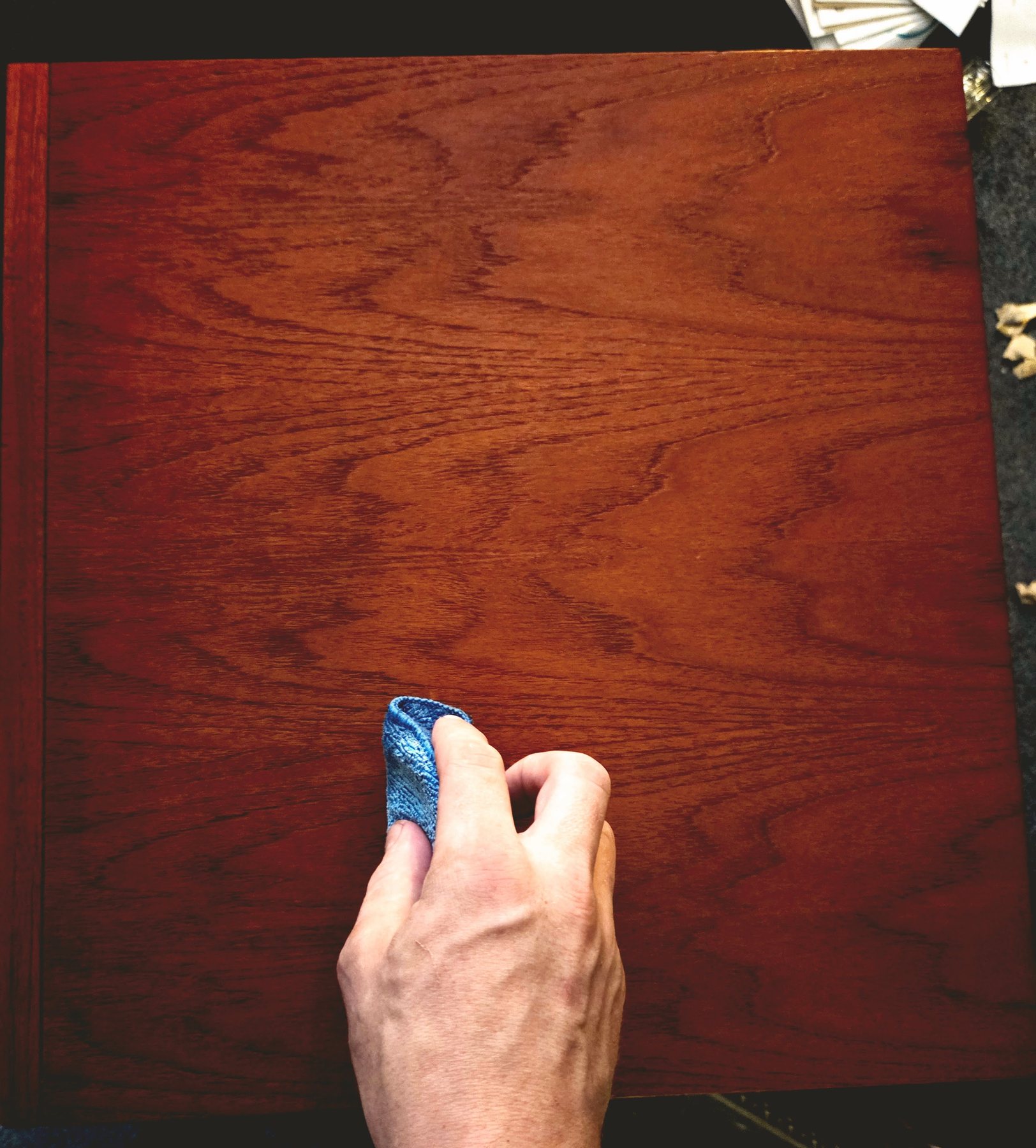 Hand-polishing a deeply finished timber surface